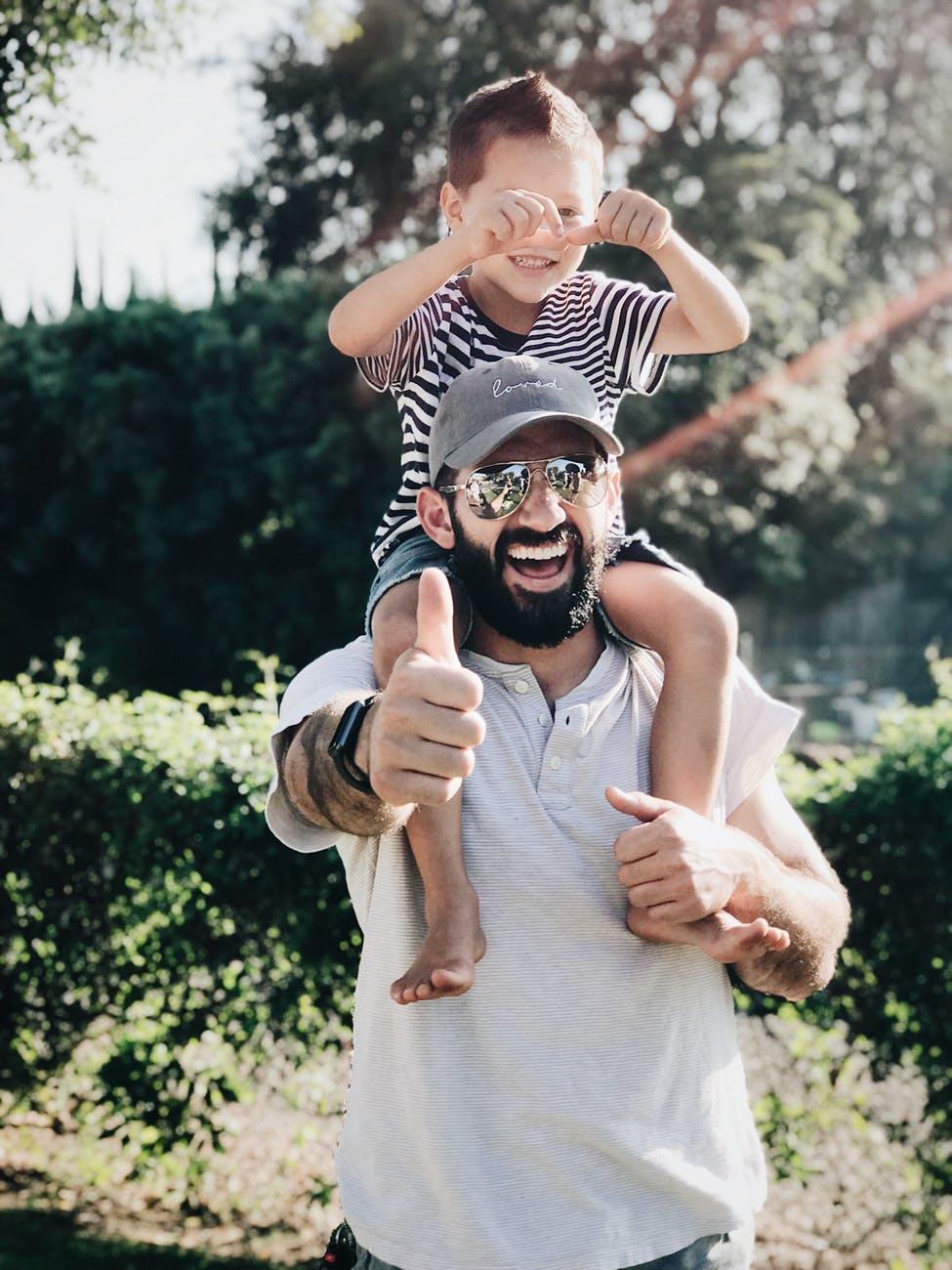 Dad with son on shoulders